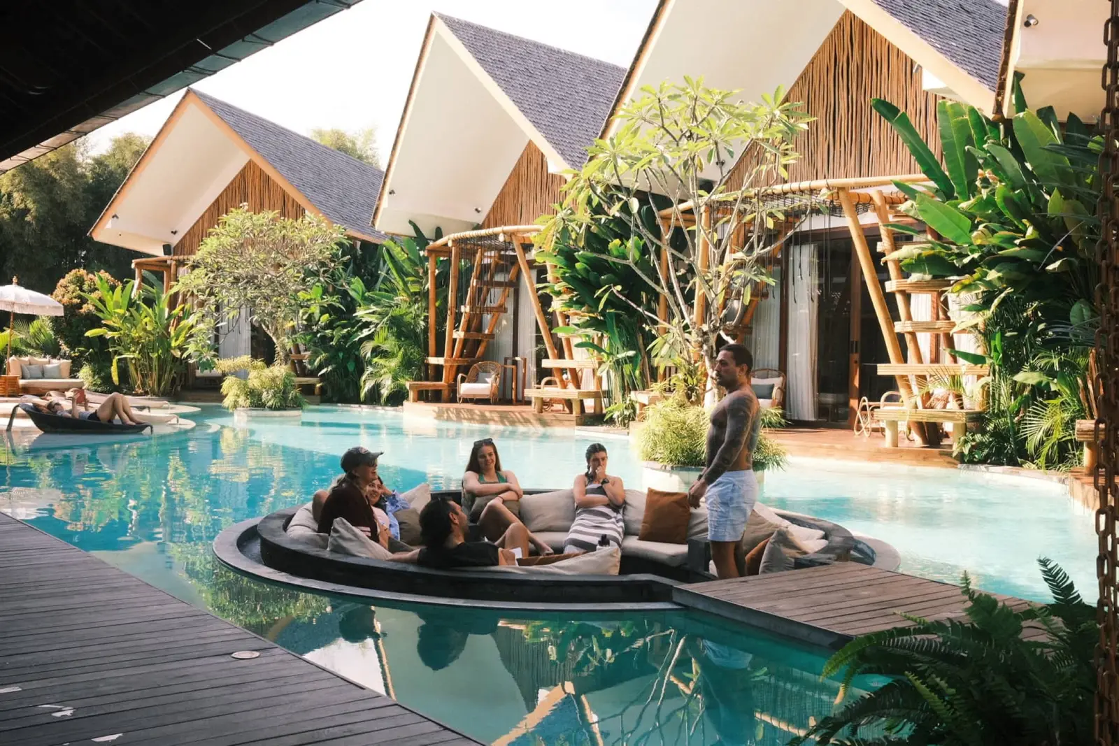 The villa pool and bungalows